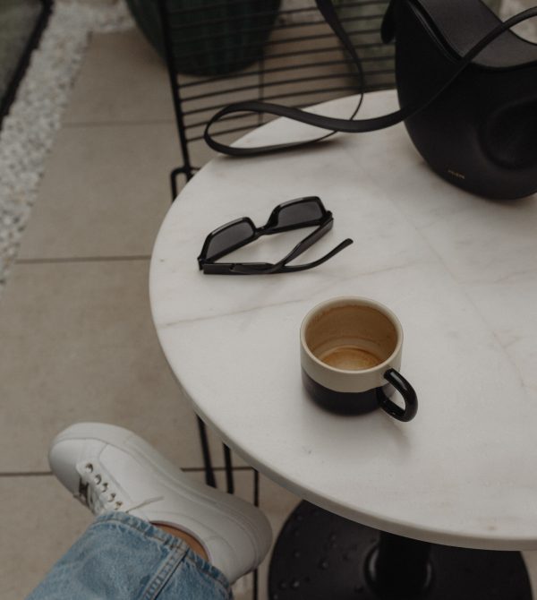 kaboompics_cozy-indoor-scene-woman-enjoying-a-cup-of-coffee-at-a-white-marble-table-32599